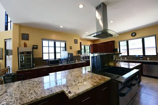 Modern kitchen with granite countertops at Vanity Wellness Center, a detox center in Los Angeles.