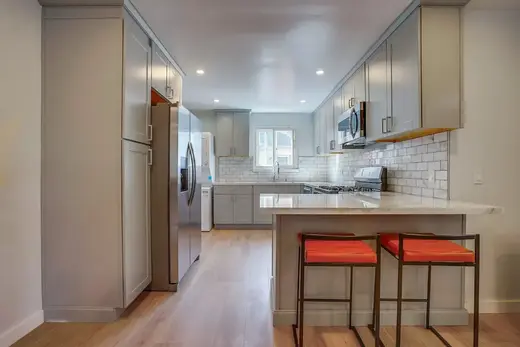 Modern kitchen with island at Bridges Recovery Sober Living Apartment Homes, a sober living home in Los Angeles.