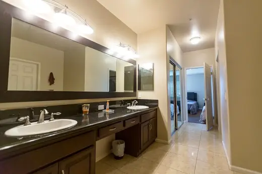 Spacious bathroom with double sinks at The Last House, a sober living home in Los Angeles.