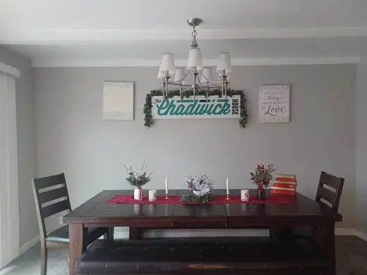 Elegant dining area with a chandelier at The Chadwick House sober living home in Los Angeles.